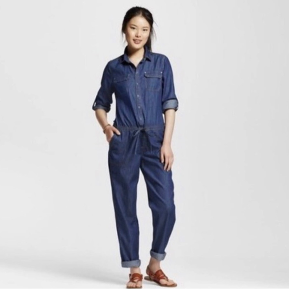 Dollhouse blue chambray jumpsuit with 6 pockets and tie waist.100% cotton S